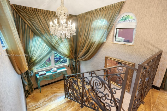 stairway featuring hardwood / wood-style flooring, a chandelier, and vaulted ceiling