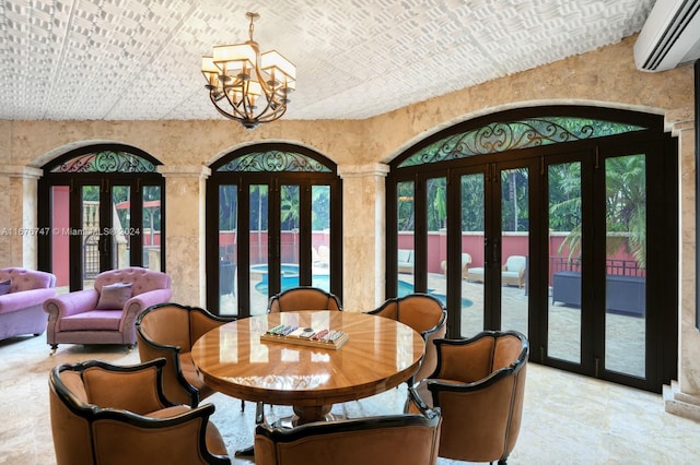 dining area with french doors, a wall mounted AC, ornate columns, and vaulted ceiling