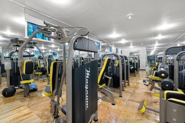 exercise room with an AC wall unit