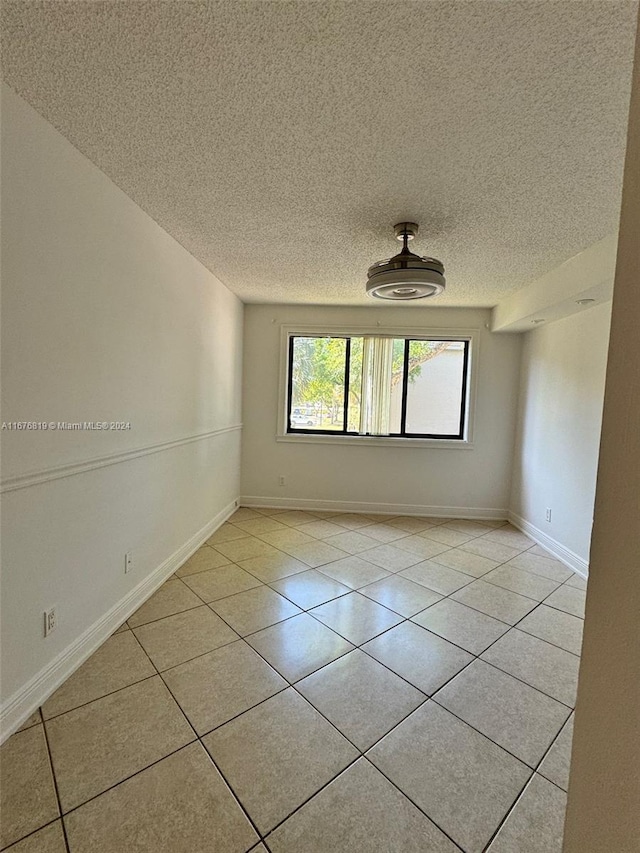 9200 W Atlantic Blvd Unit 1427, Coral Springs, FL 33071 - empty room with light tile patterned floors and a textured ceiling