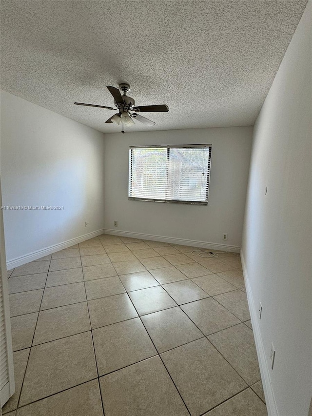 9200 W Atlantic Blvd Unit 1427, Coral Springs, FL 33071 - unfurnished room with a textured ceiling, tile patterned floors, and a ceiling fan