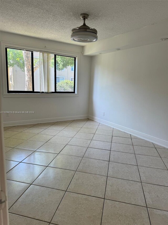 9200 W Atlantic Blvd Unit 1427, Coral Springs, FL 33071 - unfurnished room featuring a textured ceiling and tile patterned floors