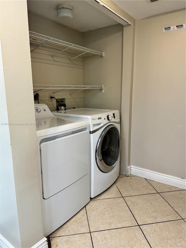 9200 W Atlantic Blvd Unit 1427, Coral Springs, FL 33071 - washroom featuring independent washer and dryer and light tile patterned floors