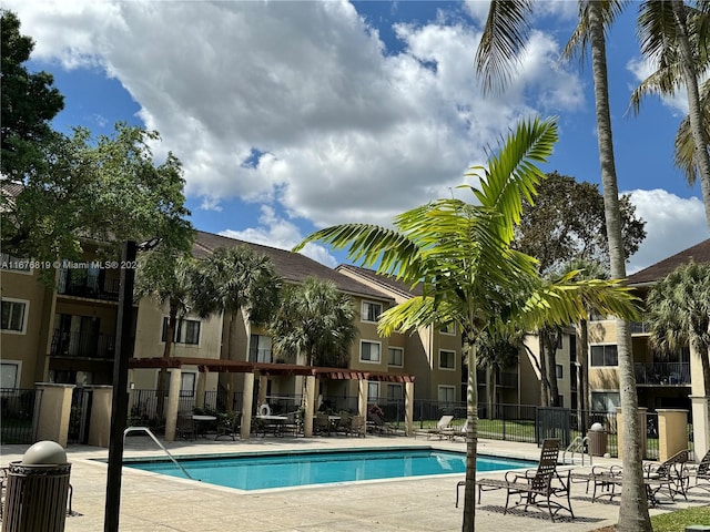 9200 W Atlantic Blvd Unit 1427, Coral Springs, FL 33071 - community pool featuring a patio