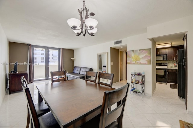 tiled dining space with a notable chandelier