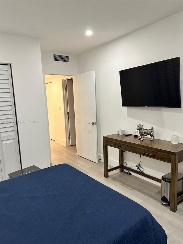 bedroom featuring light hardwood / wood-style floors