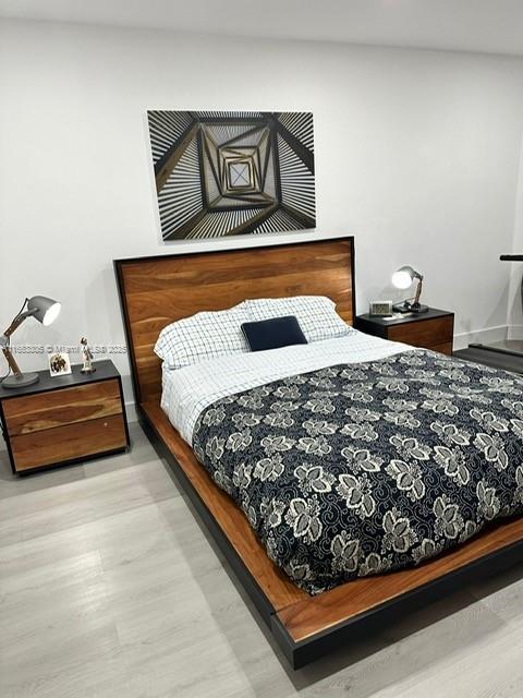 bedroom with light hardwood / wood-style floors