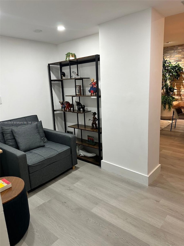 sitting room featuring light hardwood / wood-style floors