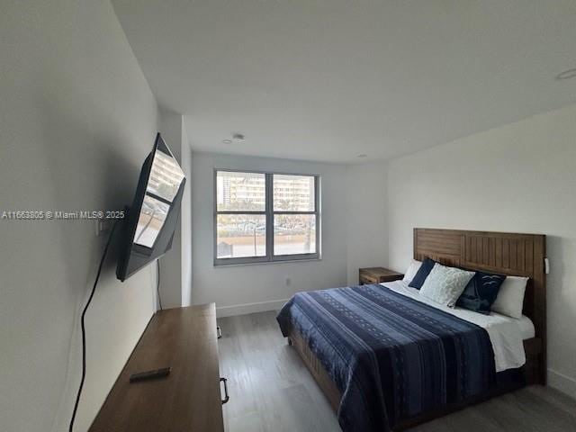 bedroom with light hardwood / wood-style flooring