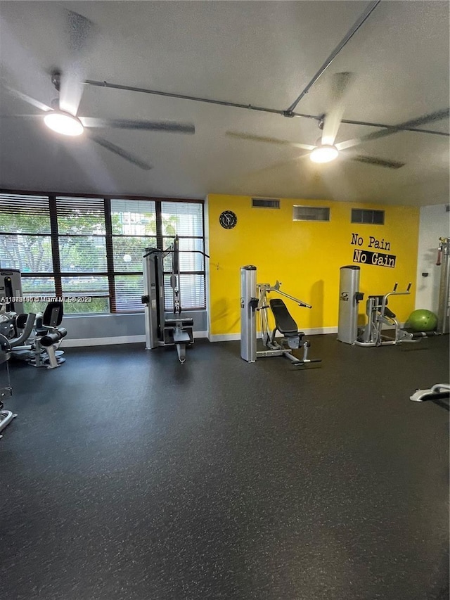 gym with a textured ceiling