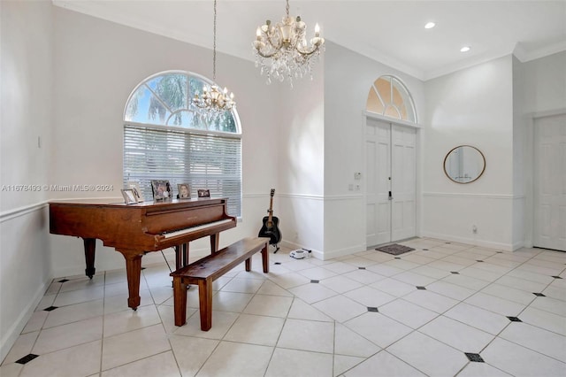 tiled foyer entrance featuring crown molding and a notable chandelier