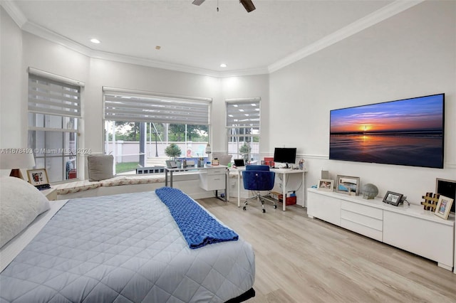 bedroom with ceiling fan, ornamental molding, and light hardwood / wood-style floors