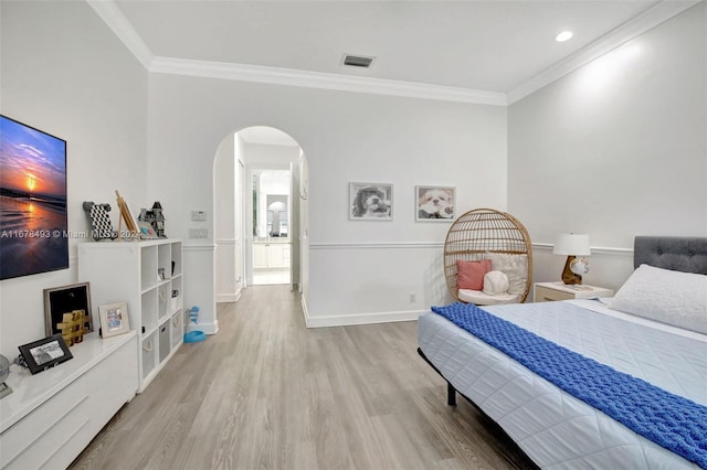 bedroom featuring light hardwood / wood-style flooring and ornamental molding