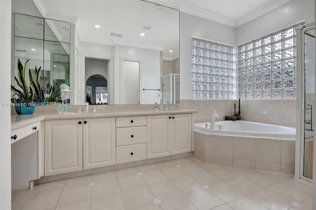 bathroom with vanity, crown molding, independent shower and bath, and a wealth of natural light