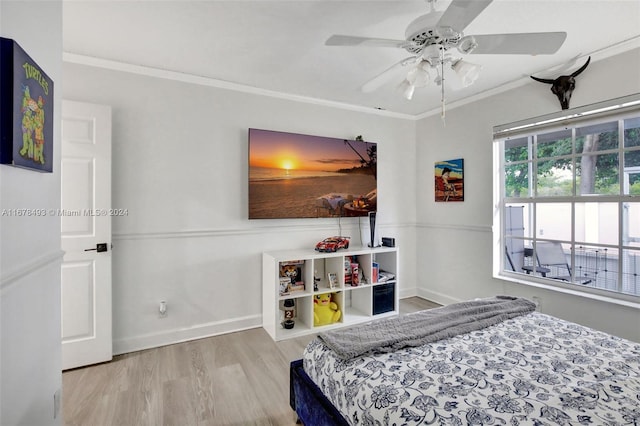 bedroom with crown molding, light wood-type flooring, and ceiling fan