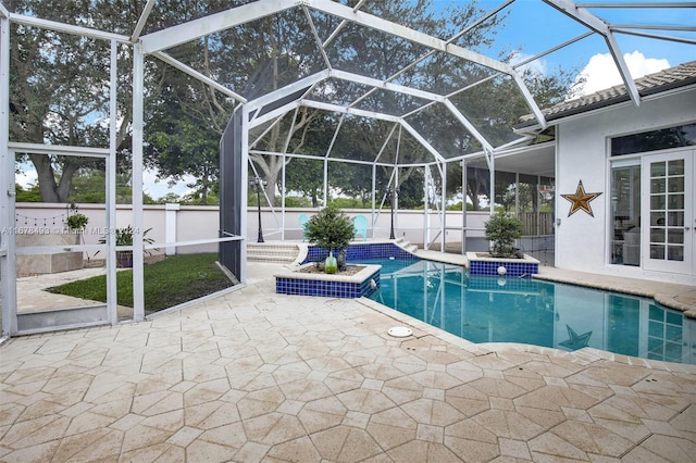 view of pool with a patio, a jacuzzi, and a lanai