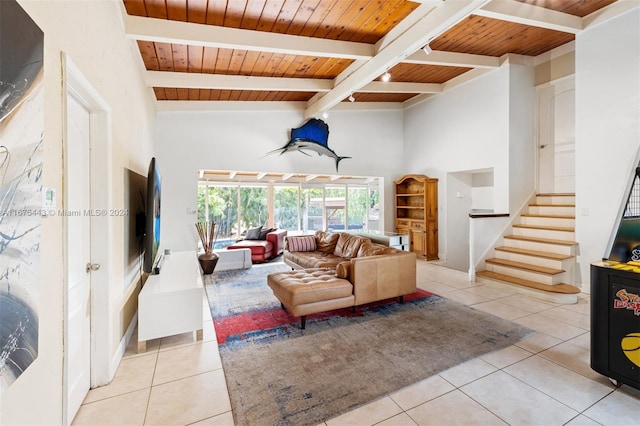 living room featuring high vaulted ceiling, wooden ceiling, light tile patterned flooring, and beamed ceiling