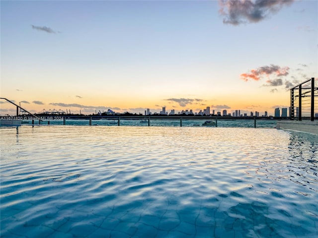 yard at dusk with a water view