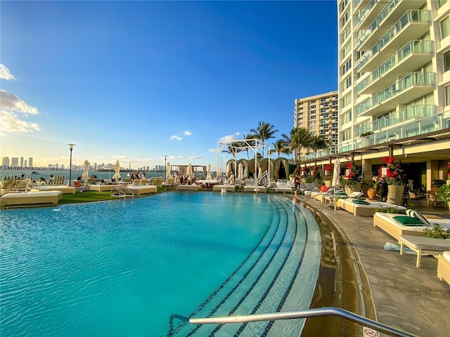 view of pool featuring a water view