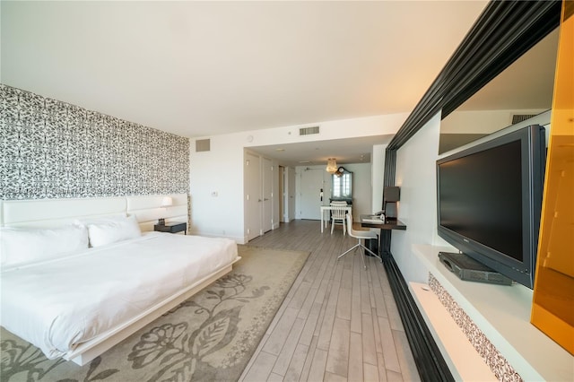 bedroom featuring hardwood / wood-style flooring