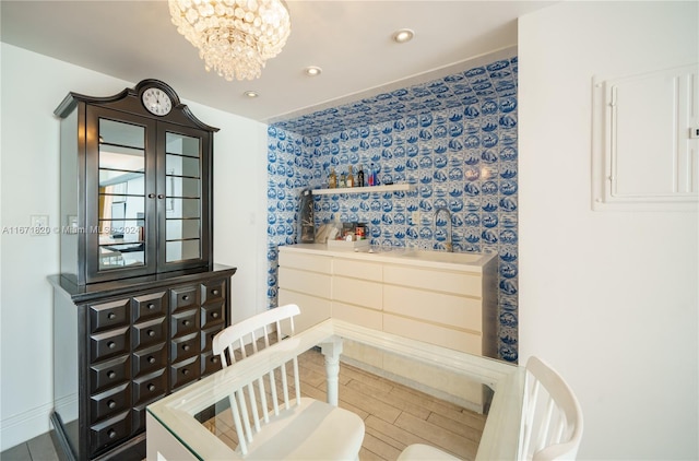 interior space with electric panel and an inviting chandelier