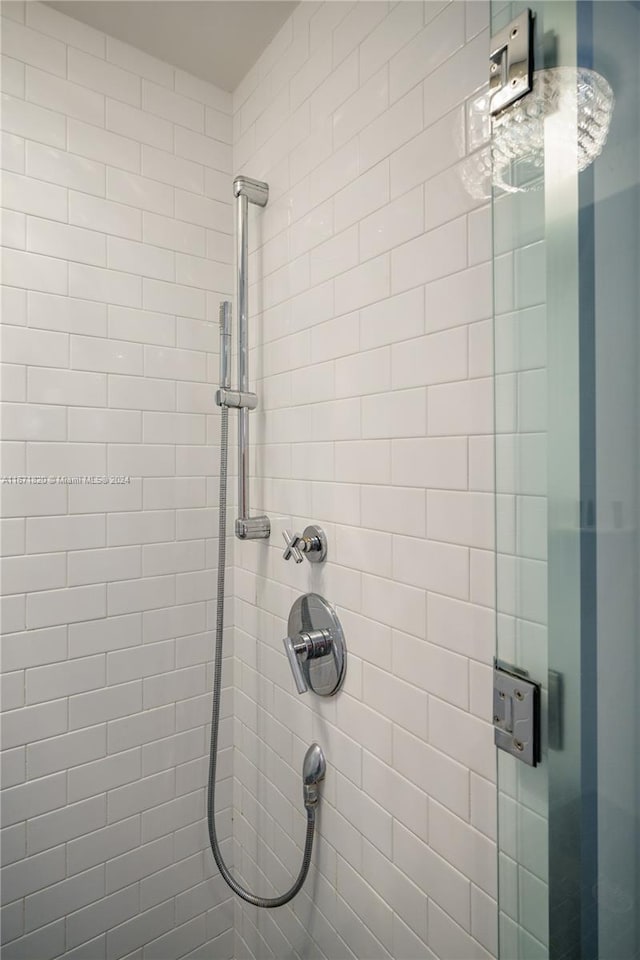 bathroom with a tile shower