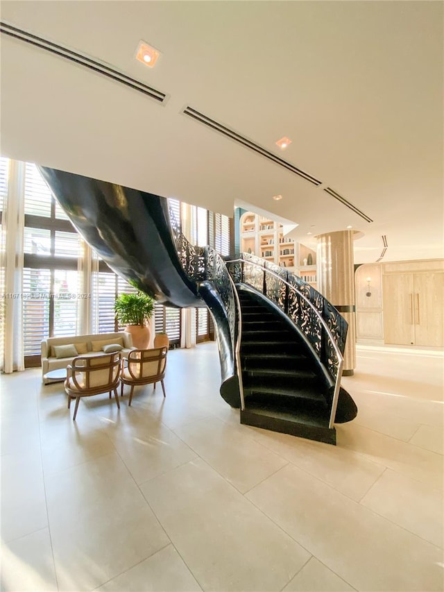 stairs featuring tile patterned floors