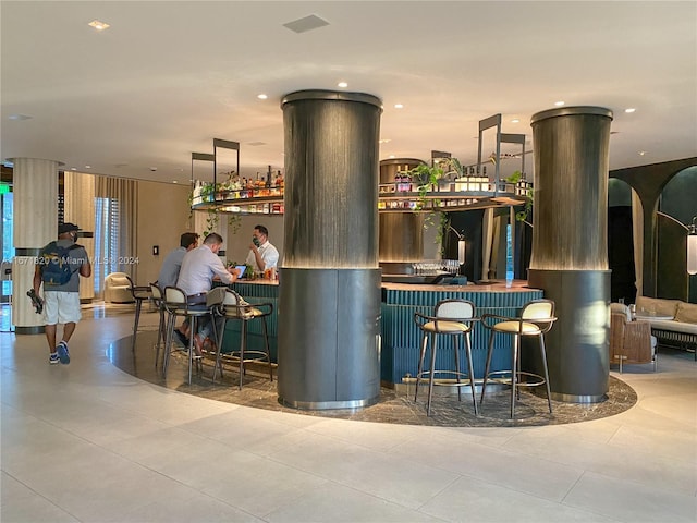 bar with light tile patterned flooring