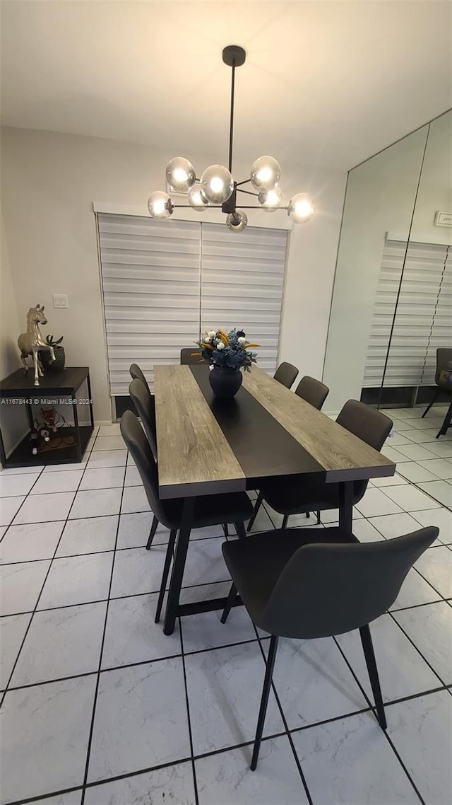 dining area featuring an inviting chandelier