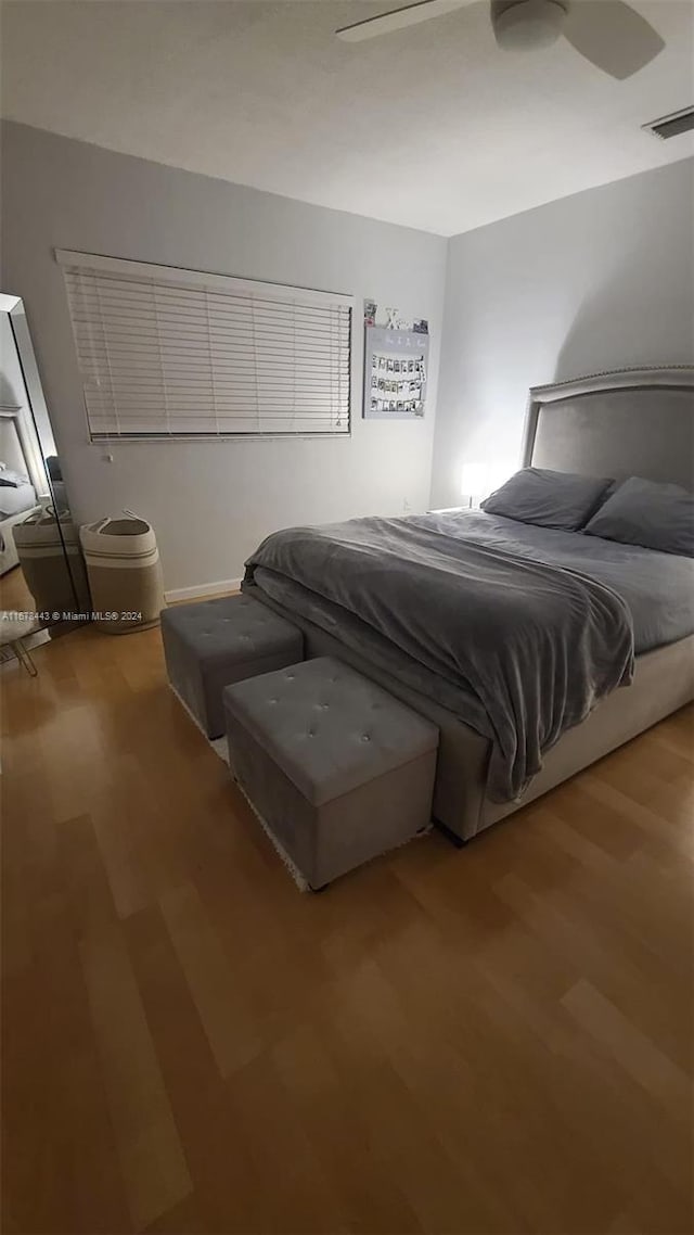 bedroom with wood-type flooring and ceiling fan