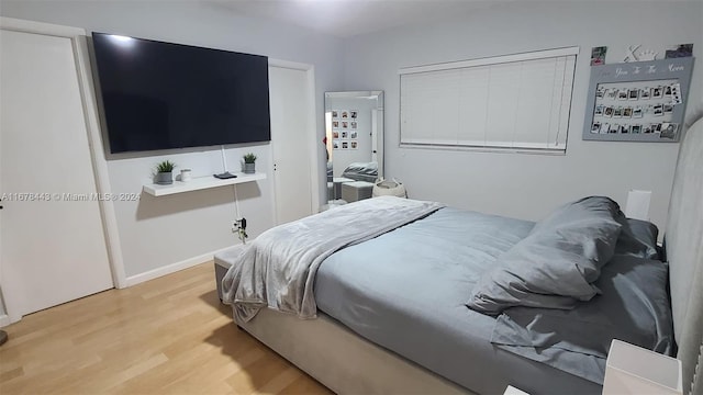 bedroom with light wood-type flooring