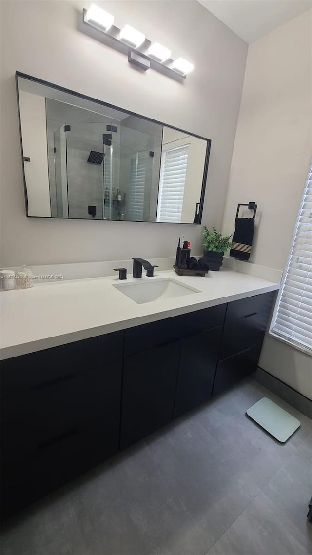 bathroom featuring vanity and walk in shower