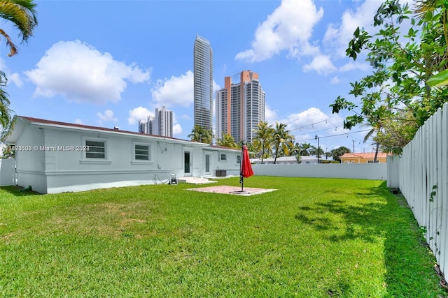 200 188th St, Sunny Isles Beach, FL 33160 - back of house featuring fence and a yard