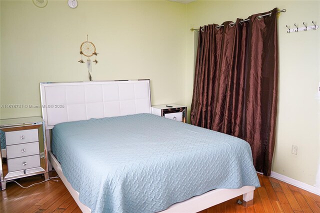 bedroom featuring hardwood / wood-style floors