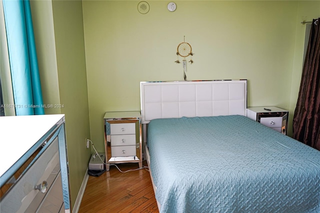 bedroom featuring dark hardwood / wood-style flooring