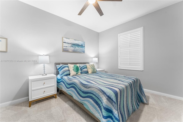 bedroom with light carpet and ceiling fan