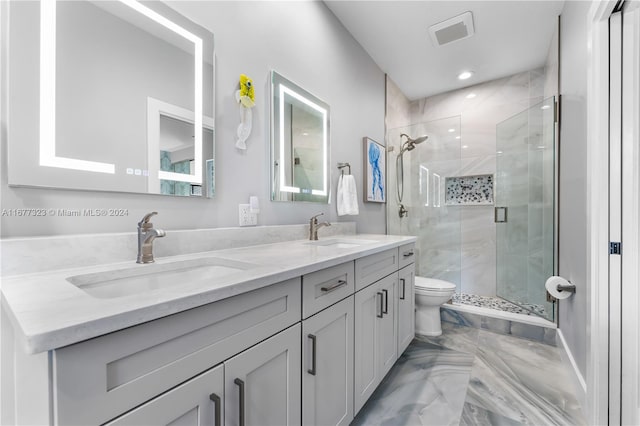 bathroom featuring vanity, toilet, and an enclosed shower