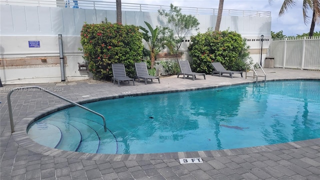 view of pool featuring a patio area