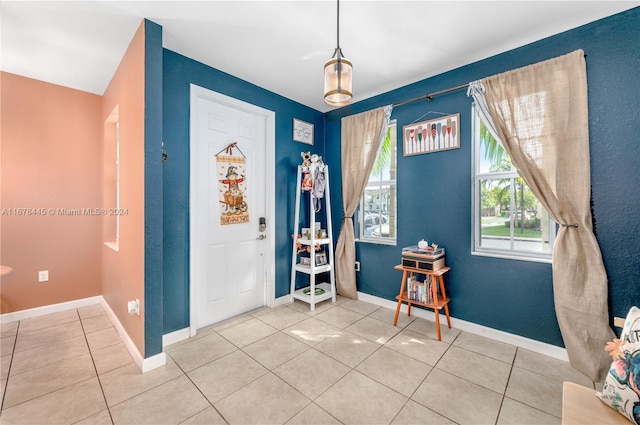 foyer entrance with tile patterned flooring