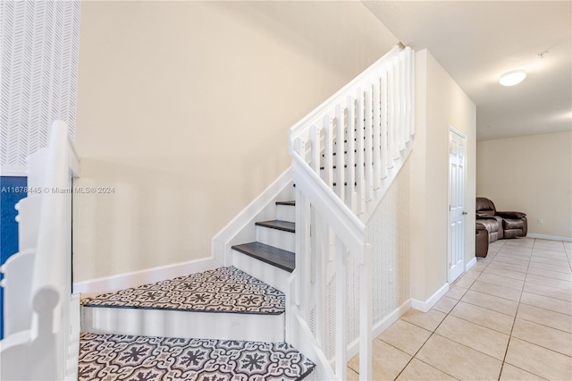 stairs with tile patterned flooring