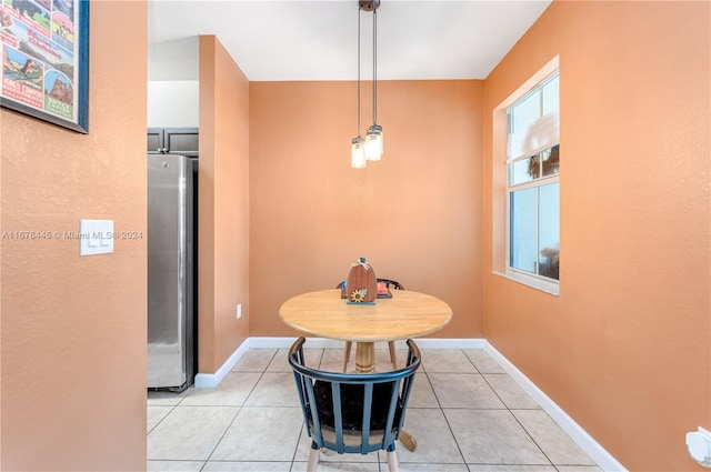 dining area featuring light tile patterned flooring