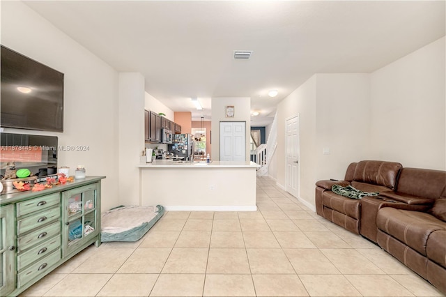 living room with light tile patterned floors