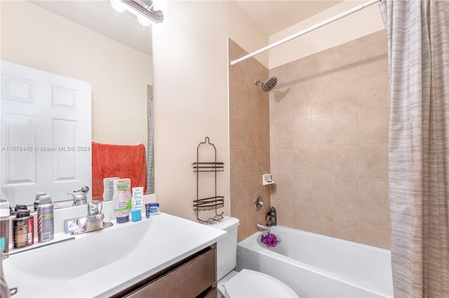 full bathroom with vanity, shower / bath combination with curtain, and toilet