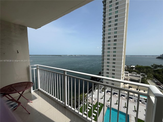 balcony featuring a water view