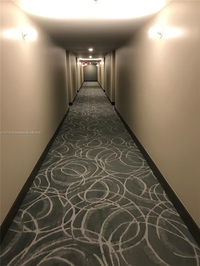hallway featuring baseboards