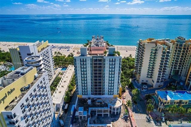 bird's eye view with a view of the beach and a water view