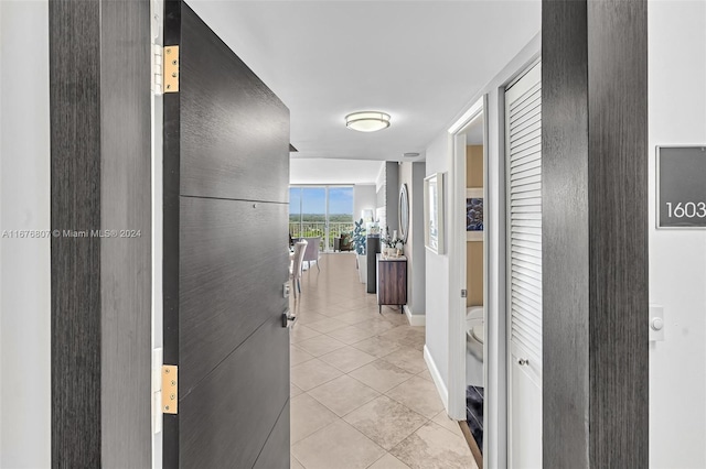 hall with light tile patterned flooring