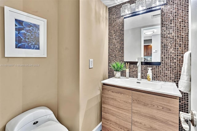 2801 NE 183rd St Unit 1603W, Aventura, FL 33160 - half bath with tile walls, vanity, tasteful backsplash, toilet, and visible vents