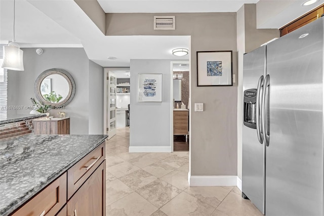 2801 NE 183rd St Unit 1603W, Aventura, FL 33160 - kitchen with dark stone countertops, visible vents, decorative light fixtures, stainless steel refrigerator with ice dispenser, and baseboards