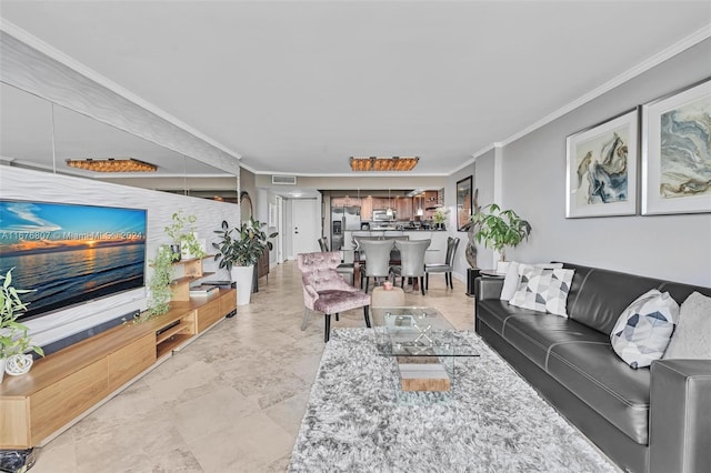 living room featuring crown molding